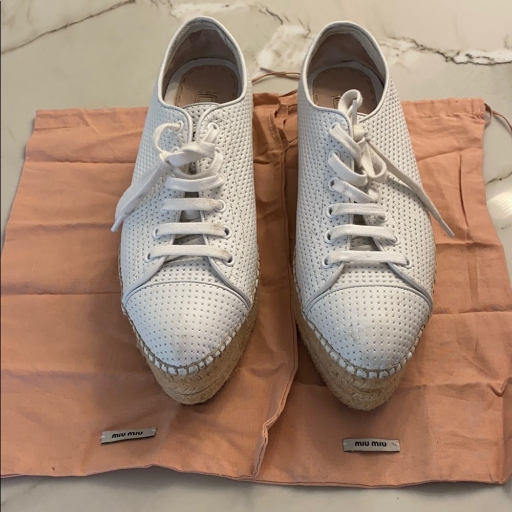 Miu Miu white leather wedge sneakers.